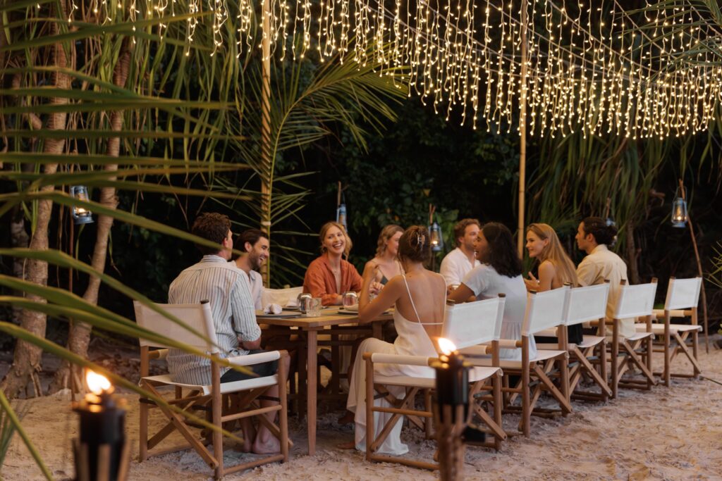 Guests dining under the stars aboard Vela with views of Wayag